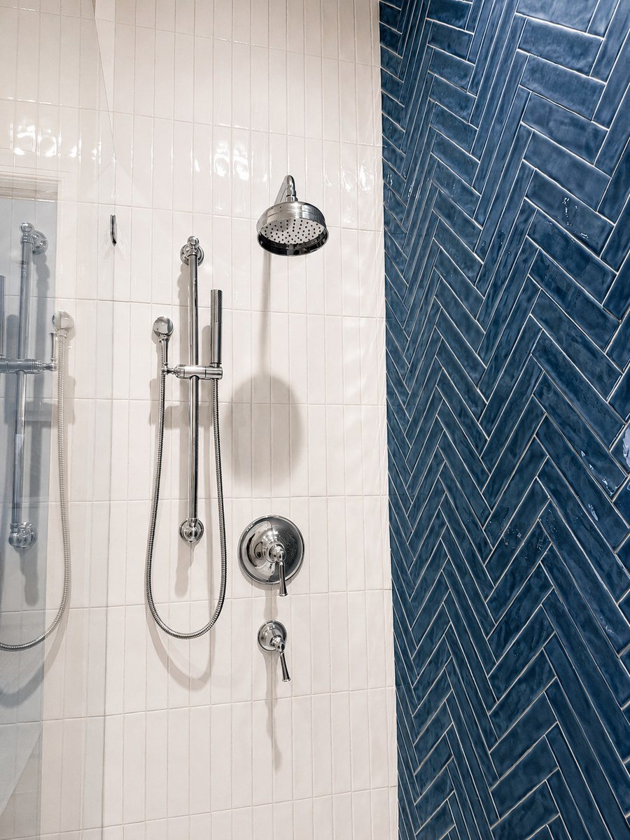 Herringbone shower with chrome fixtures